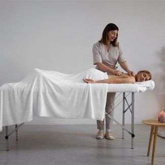 Як відрегулювати висоту масажного столу